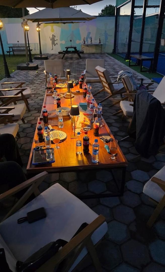 Evening lounge seating by the padel court