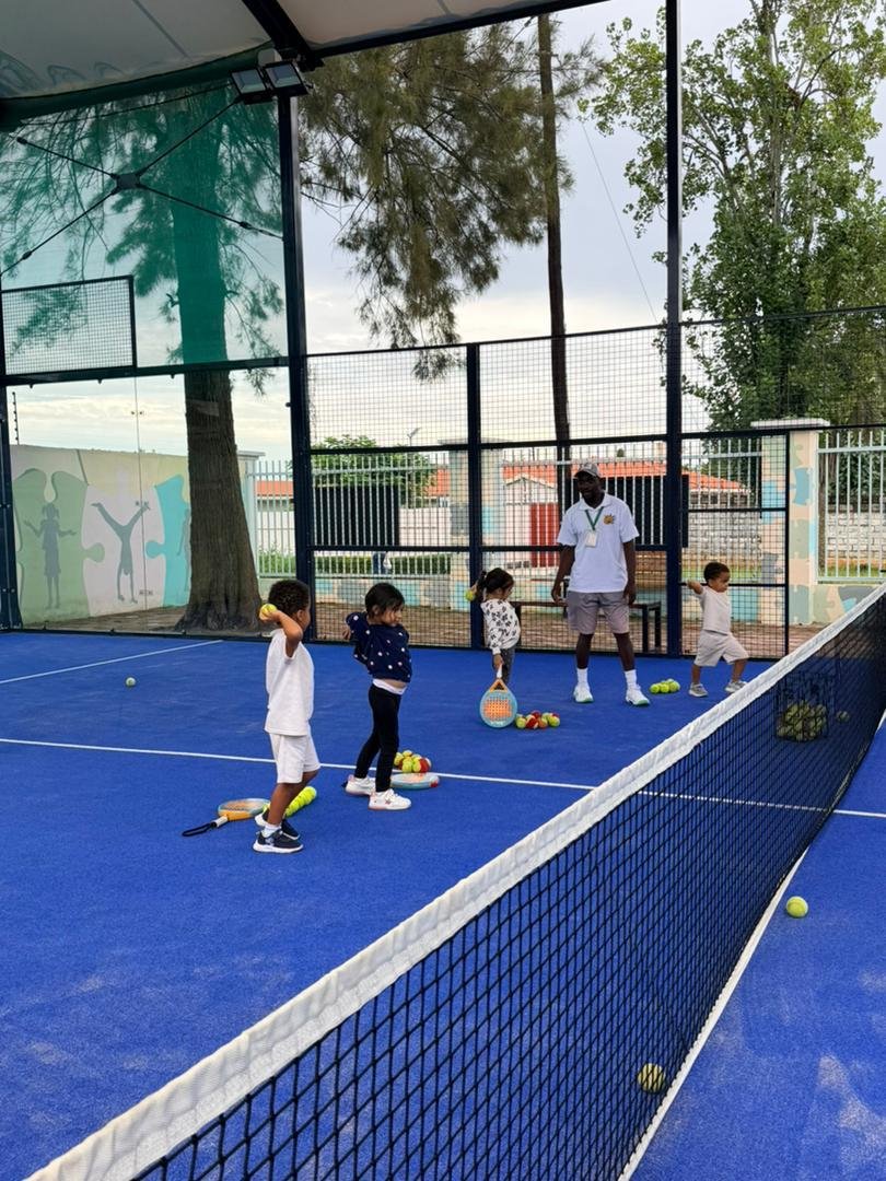 Kids padel coaching session on court